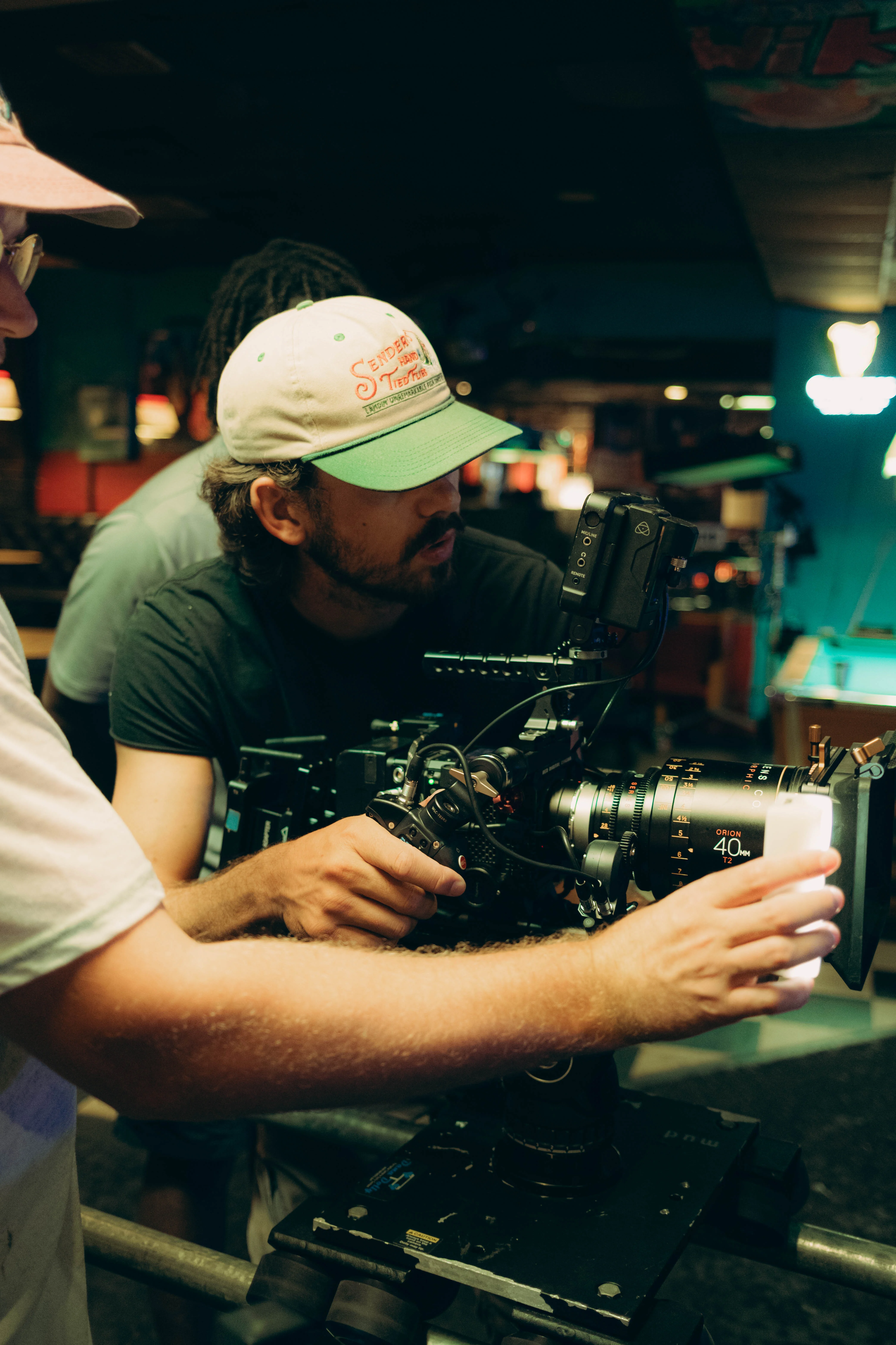 Trey Walker operating a cinema camera on location